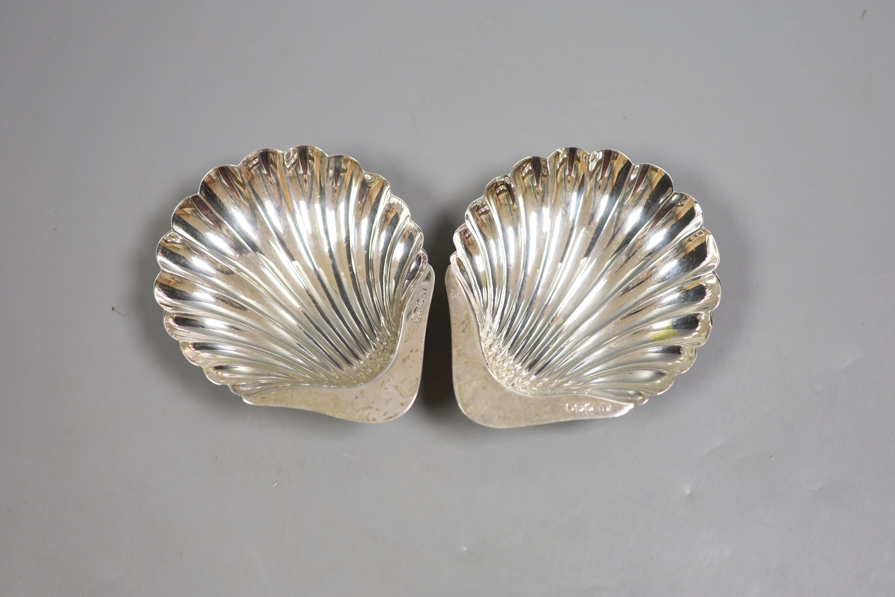 A pair of George V silver butter shells, Atkin Bros. Sheffield, 1920, 12cm, 111 grams.